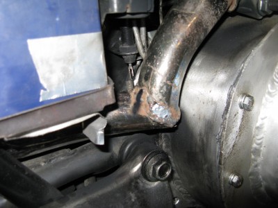 Detail of my cut and rewelded Honda exhaust pipe.  I'm confused...does it count as a ratbike if the crappy parts seem unintentional?:-)