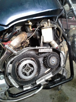 The completed primary drive.  I used a piece of ready rod to adjust tension on the primary chain.  It hasn't stretched much.  I hope the tensioner lasts.  It was originally what tensioned the big laminated chain that went from the crankshaft to the transmission on a 1981 Honda CB1100.  In that application it was tensioned by engine oil pressure.