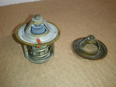 OEM thermostat cracks open at 160 F on left. Currently running "shell" on right.